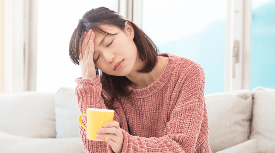 A young woman feeling stressed about her life may need alternate therapy options like acupuncture and chinese medicine to assist in health and wellness